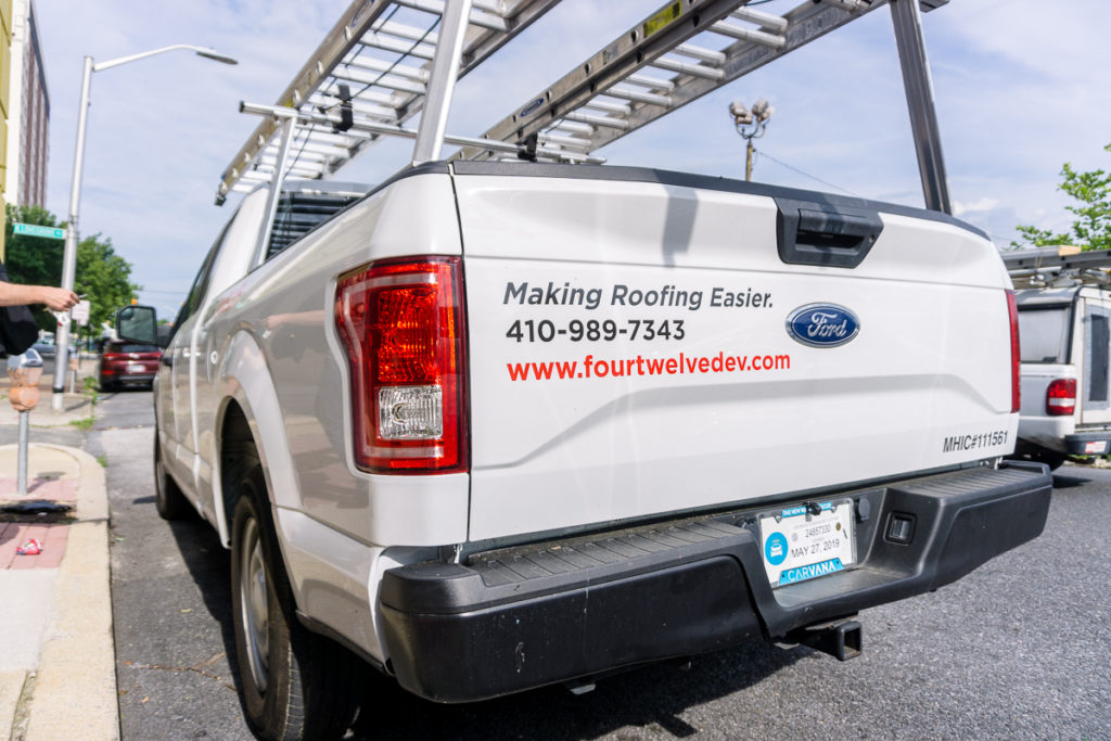 Four Twelve work truck with "making roofing easier" tagline.
